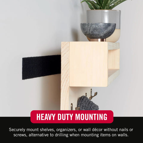 VELCRO Brand heavy-duty mounting tape, 1.5-in black, 16 ft roll for indoor/outdoor use, mounted on wall.
