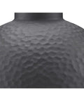 Close-up of textured black surface on Englewood Collection 1 Light Farmhouse Outdoor Wall Lantern In Textured Black Built To Last Weatherproof Exterior Light With Classic Rustic Vibe And Durable Modern Curb Appeal.