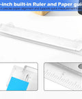 Portable 3 Hole Punch For 3 Ring Binders With One Quarter Inch Holes, shown with built-in 10-inch ruler and scrap tray in use
