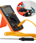 Go To Digital Multimeter Tester AN8009 With Bag And Backlit LCD Display Dope Features Include Ammeter Voltmeter Ohm Meter 16 In 1 Multifunction Test Line Auto Range Inductive Measurement Accurate Readings For DIY And Pro Projects with probe and wires, displayed on table, showing display screen and orange casing.