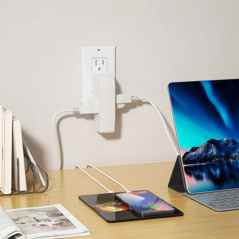 Triple Outlet Wall Tap Adapter With 3 Prong Plug For Behind Furniture, shown in use on desk with laptop and phone