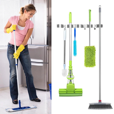 Woman mopping next to Heavy Duty Stainless Steel Broom Holder Wall Mount With Five Racks And Four Hooks Space Saving Mop Organizer
