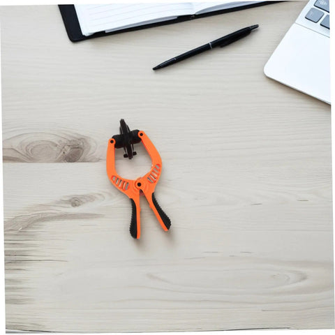 Phone Screen Opening Tool With Durable Suction Cup And LCD Separation Pliers for Quick DIY Repairs on a wooden desk