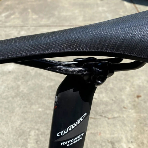 Side view of bike seat with Titanium Seatpost Ear Clamp Kit For Oval Carbon Rails 7x9 Bolt CNC Machined Aluminum Clamp Ritchey WCS