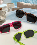Heavy Duty Grind Ready Anti Fog Safety Glasses With Scratch Resistant Ruby Smoke Tint Polycarbonate Unisex Fit UV Shielding Real Deal Coverage For Any Task on table with coffee.