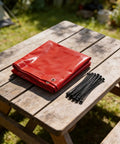 Folded Heavy Duty Welding Curtain Screen 6 By 6 Feet Flame Resistant Vinyl Shield With UV Protection Level 6 Red on table