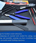 Gundam Model Tool Kit 28 Piece All In One Hobby Building Set with pliers, files, and tweezers displayed on a black surface.
