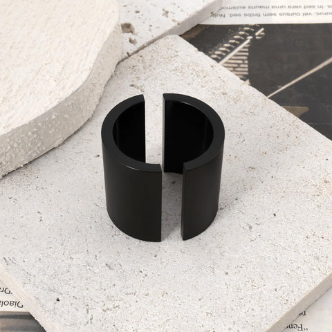 Close-up of black handlebar reducer from Pair Pit Bike Handlebar Reducers 28mm To 22mm Convert Fatbar To Seven Eighths Inch Riser Spacers