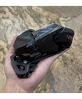 Person holding Wireless Electronic Groupset For Gravel Bikes With Hydraulic Disc Or Rim Brakes 3 To 14 Speed Range 75mm Shifter Spacing Wireless Shifter To Derailleur Communication Durable Gravel Ready Performance component