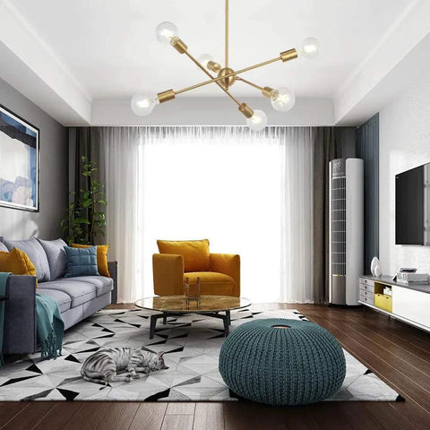 Modern Sputnik Chandelier With 6 Lights In Brushed Brass hanging in a stylish living room, mid century pendant lighting.