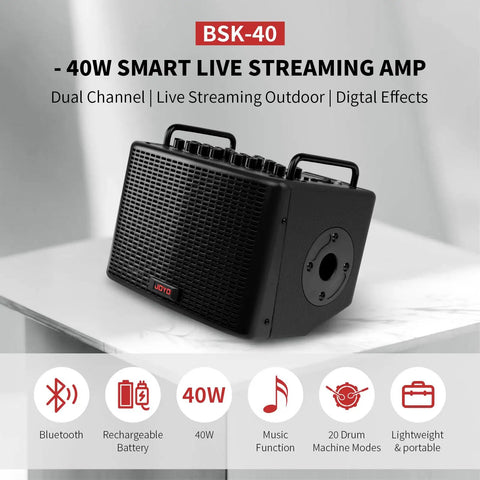 40W Portable Acoustic Guitar Amp With Rechargeable Battery Bluetooth And USB C Recording For Phone Dual Guitar And Mic Channel XLR DI Out 20 Drum Patterns And Live Streaming On The Go, featuring compact design with digital effects and dual handles.