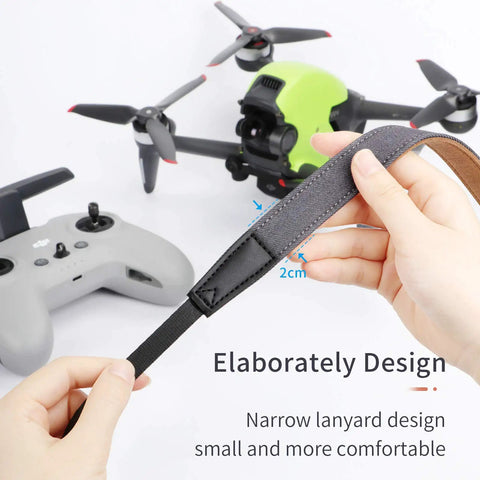 Hands holding Go To Lanyard Strap For DJI FPV Avata Phantom 4 Pro Drones And RC Transmitters near drone and controller