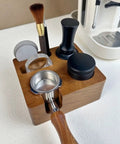Solid Built 58mm Wooden Coffee Tamper Station with portafilter, brush, and accessories on a counter.