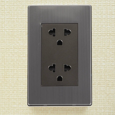 Heavy-Duty 6-Hole Circular Wall Outlet Socket Cover In Rust-Free Stainless Steel mounted on light textured wall.