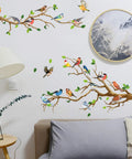 Hummingbird On Tree Branch Wall Sticker Set With Green Leaf And Flying Bird DIY Vinyl Wall Decal on living room wall.