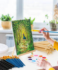 Person painting on canvas with 160 Piece Canvas With Easel Painting Kit Including Wooden Easel Blank Canvases 100 Brush Set