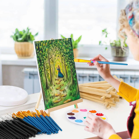 Person painting on canvas with 160 Piece Canvas With Easel Painting Kit Including Wooden Easel Blank Canvases 100 Brush Set