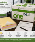 Box and stack of Carbonless Form Paper 4 Part Set 8.5 x 11 Inches Reverse Paper with Goldenrod Pink Canary White on office desk.