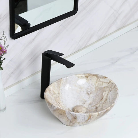 Oval Marble Vessel Sink With Pop Up Drain For Above Counter Bathroom Ceramic Vessel Sink With Nordic Marbling on countertop