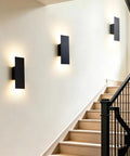 Oberade Single Hardwired Black LED Wall Light Bathroom Sconce 3000K Indoor mounted on a staircase wall, providing elegant illumination.