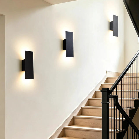 Oberade Single Hardwired Black LED Wall Light Bathroom Sconce 3000K Indoor mounted on a staircase wall, providing elegant illumination.