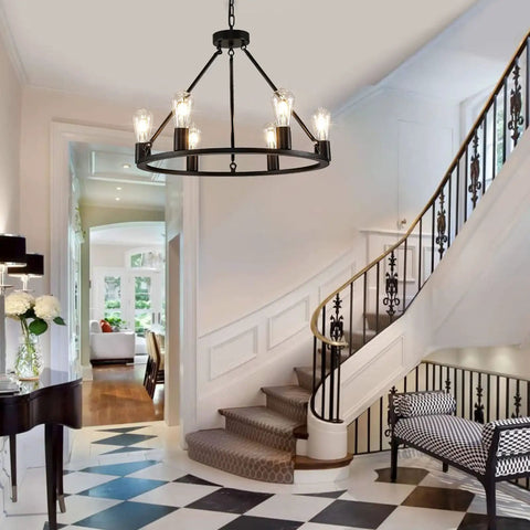 Industrial Black Wagon Wheel Chandelier With Six Candle Style Lights in elegant hallway, 23.6 Inch Metal Round Light.