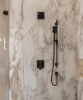 Stylish bathroom with heavy duty 59 inch metal shower hose assembly in matte black finish for handheld sprayers.