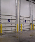 Slide On Yellow Bollard Post Cover For Warehouses Made From Durable Low Density Polyethylene Thermoplastic protecting warehouse doors.