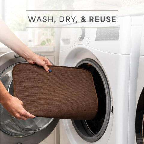 Top Shelf Microfiber Dish Drying Mat Extra Large 18 X 24 Inch Countertop Pad being placed in washing machine for easy cleaning.