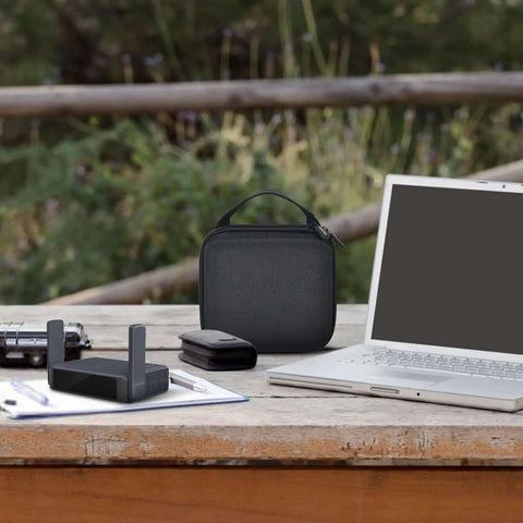 Slick Clutch Hard Shell Case For Travel Routers With Snug Mesh Pocket And Heavy Duty Zipper For Gl Mt3000 Gl Be3600 on a desk.
