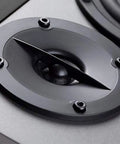 Close-up of the tweeter on R1280T Powered Bookshelf Speakers For Studio Monitoring 2.0 Active Near Field Monitors.