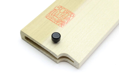 Close-up of Safety Pins For Saya Knife Covers 5 Piece Set With Snug Fit, Adjustable 4.3mm To 2.5mm Width, black pin on wood