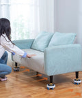 Heavy Duty Furniture Mover Set With Wheels To Slide Couches, Fridges, And Washing Machines Effortlessly Across Wood Floors And Carpets For Any Tough Moving Job Without A Struggle. A person using sliders on a couch.