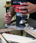 Dead Nuts Perfect Single Grip Router Base Plate For Milwaukee M18 Fuel Compact Router 2723 20 in use on wood surface.