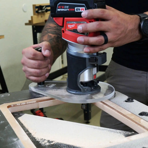 Dead Nuts Perfect Single Grip Router Base Plate For Milwaukee M18 Fuel Compact Router 2723 20 in use on wood surface.