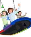 Three kids smiling on 66 Inch Oval Saucer Swing For Kids And Teens Outdoor Indoor Backyard Fun With Adjustable Ropes Durable Seat Supports Up To 700 Pounds Includes Safety Net