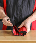 Person holding roll pouch of Heavy Duty Built To Last Pro Grade 16 Piece Punch And Chisel Set for automotive and DIY projects
