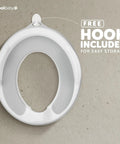 Toddler Potty Training Seat With Sure Grip Handles And Non Slip Base For An Easy Peasy Transition To The Big Toilet Includes Splash Guard Plus Handy Wall Hook Gray positioned on a surface with a free storage hook.