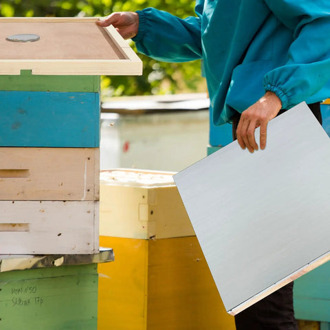 Person assembling 2 Pack Telescoping Beehive Cover Kit With Inner Covers And Feeding Jar Lids For 10 Frame Beehives