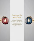 Mid‑Century Modern Globe Glass Wall Sconce with Wine Red Hand‑Blown Glass featuring a ribbed globe shade and gold hardware.