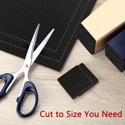 Scissors cutting Grippy Non Slip Furniture Pads 12 Pack 4 Inch Self Adhesive Rubber Feet For Couch Tables Chairs Shield Hardwood Floors From Scratches And Slips No More Dragging Or Scrapes to size on a table.