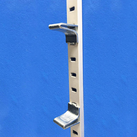Adjustable Steel Pilaster Shelf Support Clips Set of 14 with Zinc Finish for Standard Shelving Systems installed on blue wall.
