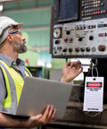 Worker using No Sweat Bulk 50 Pack Danger Out Of Service Tags For Industrial Facilities With Double Sided Bold Print for machinery.