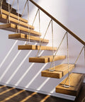 Top Shelf 8 Inch Galvanized Cast Iron Boat Dock Cleat Rigged Up For Heavy Duty Marine Tie Downs To Safely Secure Boats And Piers Deck Ready Nautical Hardware Essentials on a modern staircase with wooden steps.