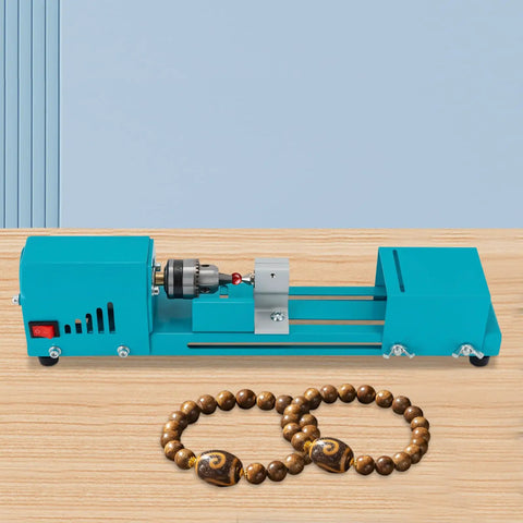 Mini Wood Lathe Machine With A Hella Strong 96W Copper Motor Spinning At 9000 Rpm for crafting beads on a wooden surface.