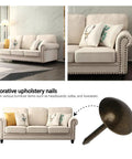Top Shelf Upholstery Tacks And Furniture Pins For Decorative Fabric Fastening 100 Pack Hella Durable Hardware with decorative bronze upholstery nail next to sofa.