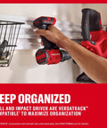 Badass 20V Cordless Drill And Impact Driver Combo Kit With Two 2Ah Lithium Batteries And Charger on Versatrack system for storage.
