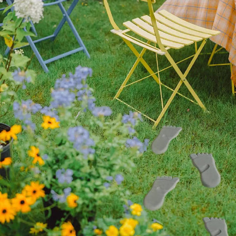 Two-Piece Concrete Footprint Stepping Stone Template Kit for Walkways, Garden, Yard and Patio Decor installed among flowers