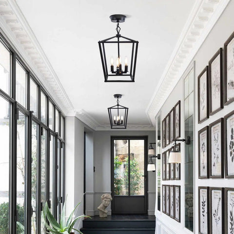 Farmhouse Lantern Pendant Light for Kitchen Island and Dining Room, 12 Inch Black Openwork Cage Chandelier in a hallway setting