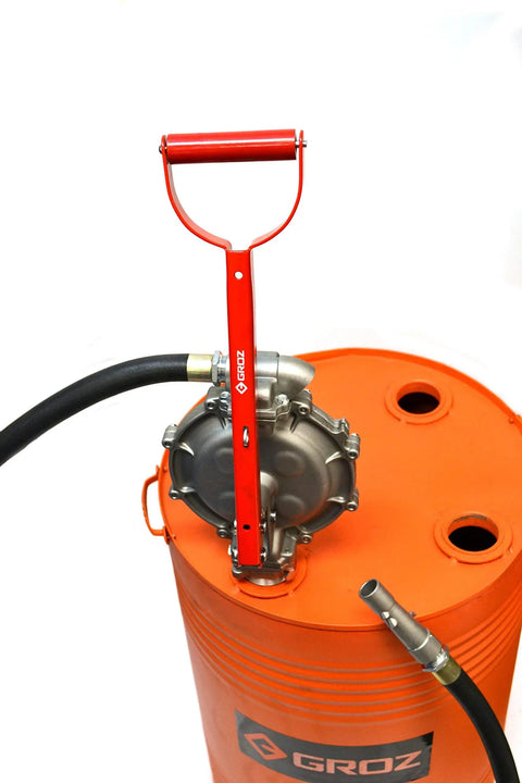 This Heavy Duty Double Diaphragm Hand Fuel Transfer Pump Delivers Quick Eight Hundred Ml Strokes and Includes an Eight Foot Anti Static Hose on an orange drum.